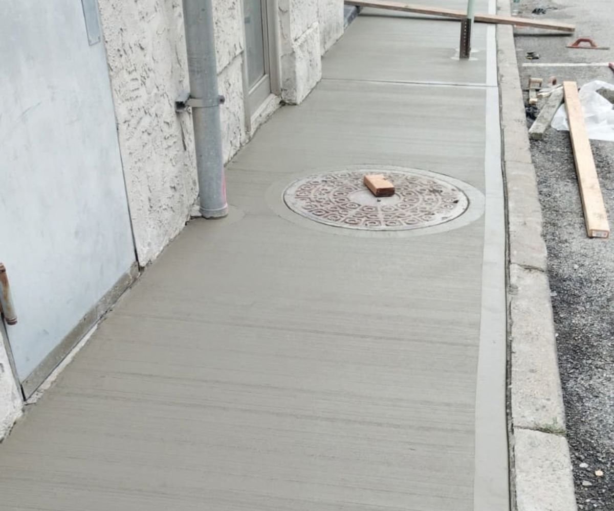 Newly installed concrete sidewalk outside the commercial property at 107 Lake Ave in Tuckahoe, NY.