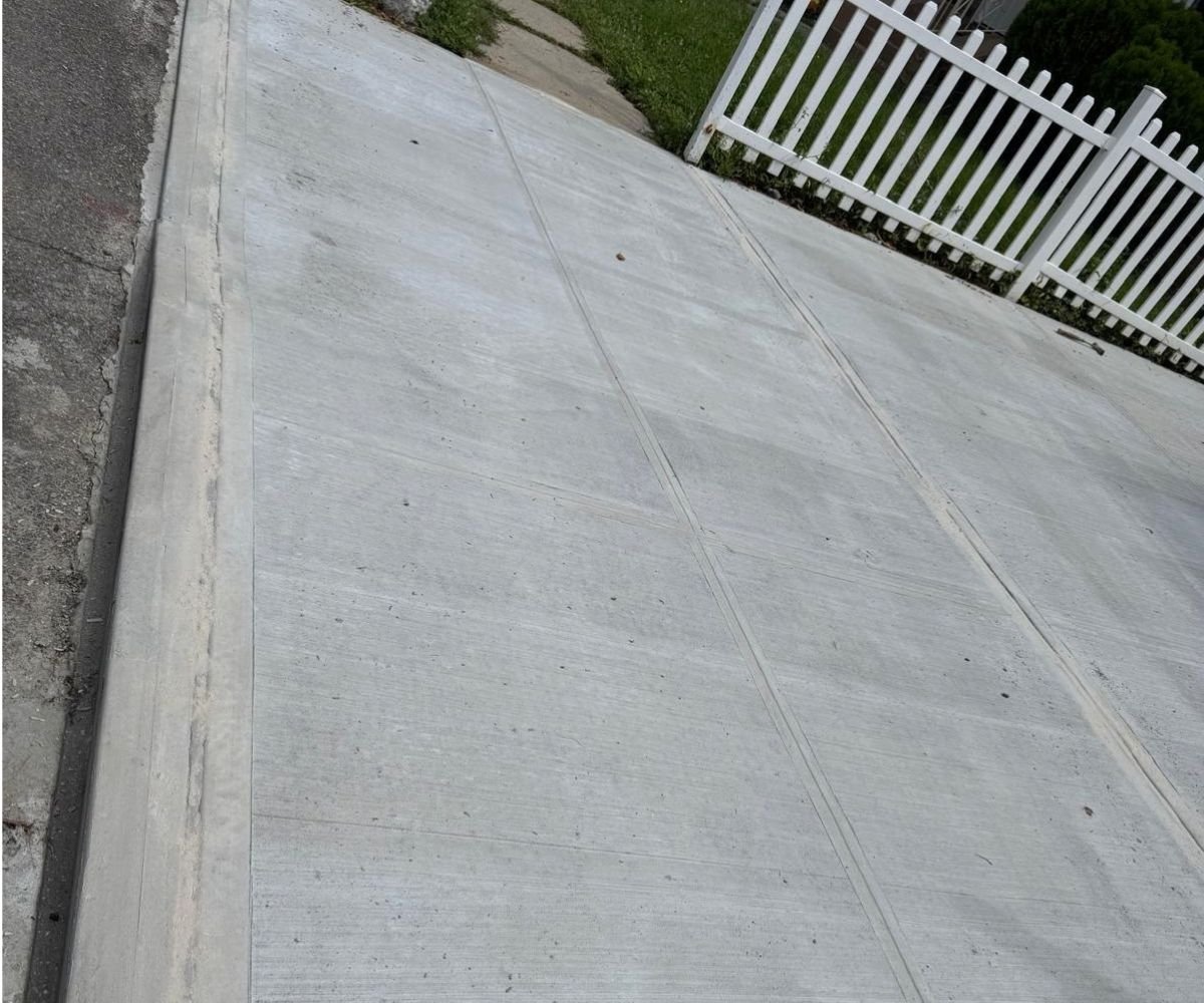 Completed concrete driveway and sidewalk replacement in Cambria Heights, Queens