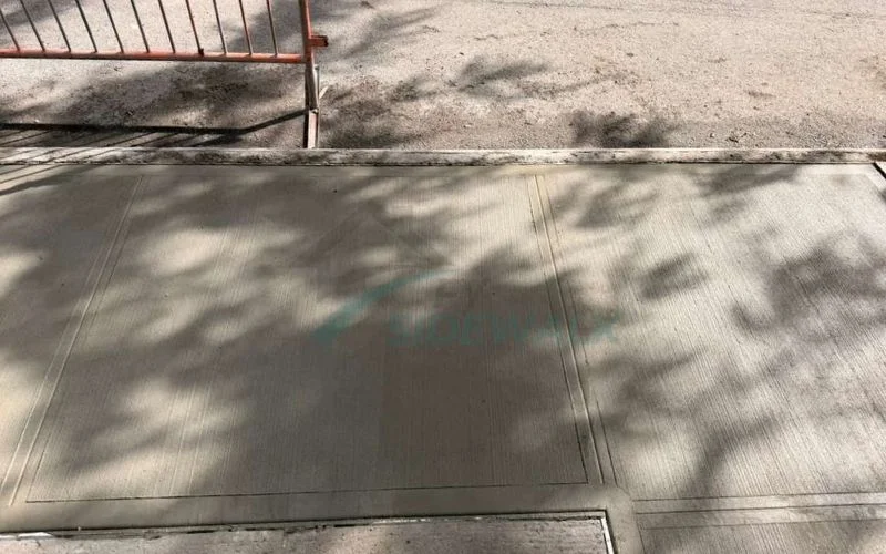 fresh concrete sidewalk slabs after repair in manhattan