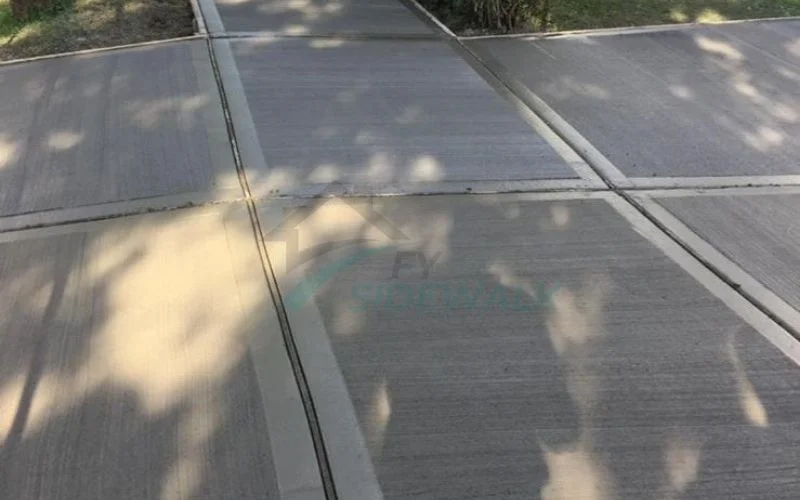 newly repaired sidewalk slabs on a residential brooklyn block