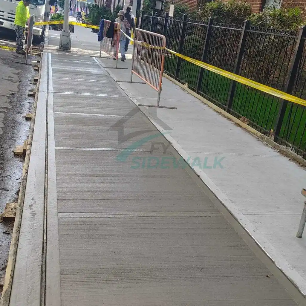 New concrete sidewalk installation in the Bronx after repair work by a sidewalk contractor.