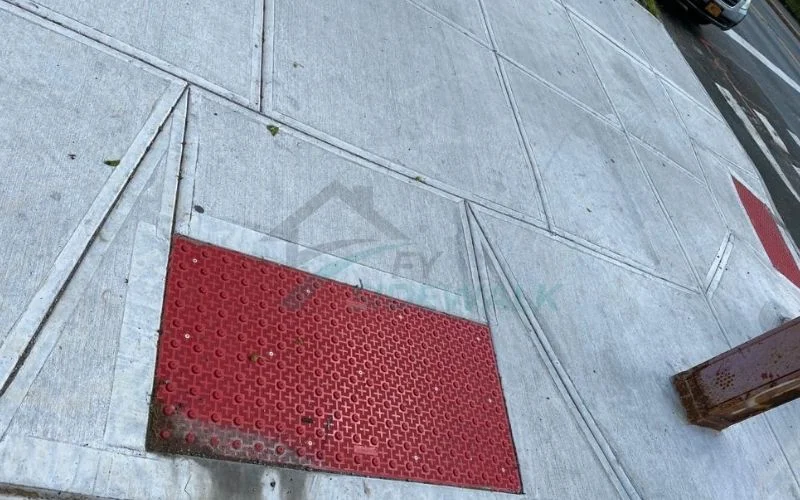 replaced sidewalk concrete around a utility cover in manhattan